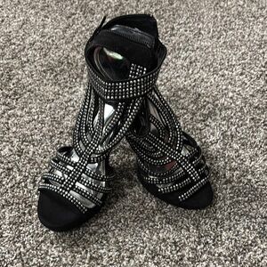 Jennifer Lopez Black and Silver Heels with Strappy Design